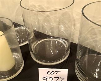 Lot 9277.  $50.00.  3 - 10"H x 8 diam glass vases/pillar candle holders and 1 vase with candle that is 6" x 8".
