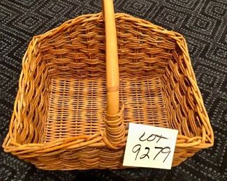 Lot 9279.  $40.00.  Wicker basket with handles (14"W x 18" L x 10" D) and a white washed wicker basket with bamboo handles (15"W x 1" L x7 d)