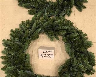 Lot 9287.  $40.00.  Two - 23" diameter lighted, green Christmas wreaths.