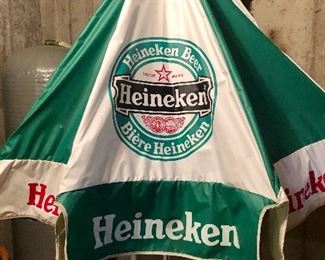Lot 9291.  $145.00.  Heineken patio table umbrella and a Heineken logo clock.  The perfect addition to your Man Cave or Bar & Rec Room!  The Heineken on ice is up to you.  Enjoy.