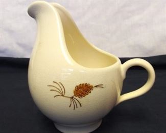 Pottery Pitcher with Pinecone Design