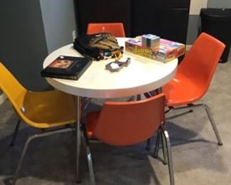 Table and chairs , metallic shirt and various rock band shirts