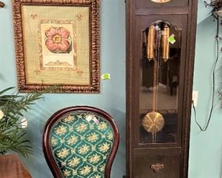 Framed Flower Art,  Green Upholstered Chair, Grandfather Clock