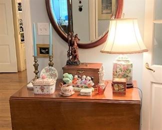 Antique drop leaf table with milk glass casters