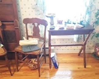 Walnut X leg table with drawer, pair of cane seat chairs