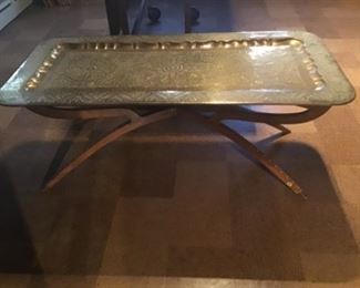 Brass coffee table on wooden stand Inlaid legs