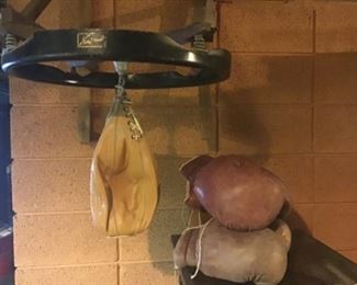 Vintage leather punching bag with Nonpareil mount and gloves  