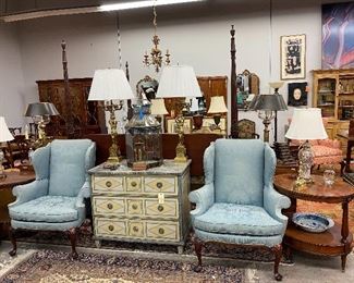 Pair of antique wingback chairs, Antique polychromed chest, pair of oval end tables, pair of brass lamps, pair of Chinese lamps.