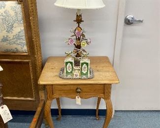 Rustic pine side table on cabriole legs, Italian enamel floral lamp.