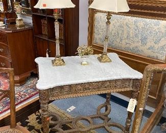 Carved wood table with marble top