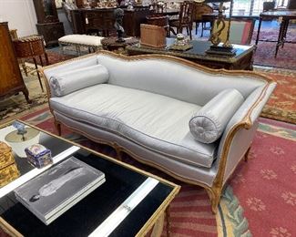 Beautiful French fruitwood sofa in a light blue upholstery. 