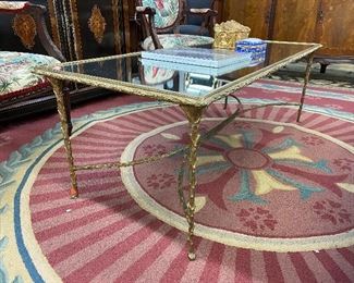 Stunning Hollywood Regency faux boi brass cocktail table.