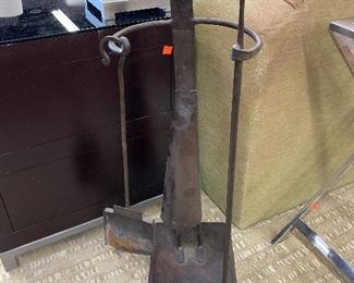 Modern primitive fireplace tool holder.