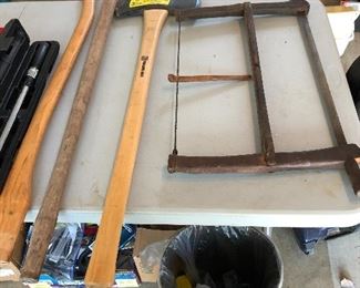 Antique Buck saw on right