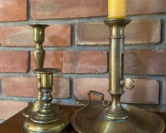 A few of several brass candlesticks throughout the home.