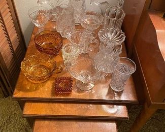 Another set of stacking tables and various vintage glass.