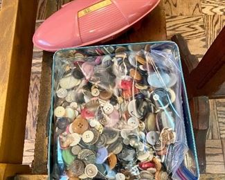 Tin filled with buttons.
