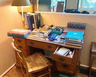 Wood desk with office supplies.