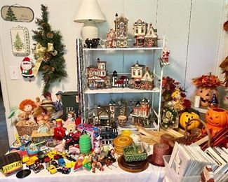 Tables full of Christmas and Halloween plus some old toys.