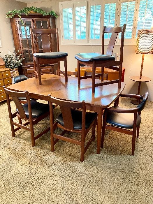 Mid century dining table with 6 chairs and 2 leaves.  