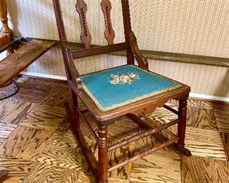 Eastlake rocker with embroidered seat.