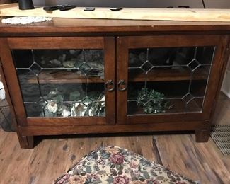 Cherry stained tv stand with leaded glass front doors
