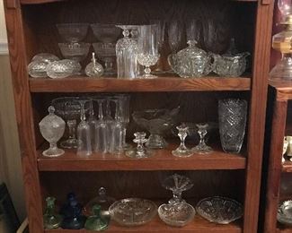 Vintage glassware in a wood bookcase