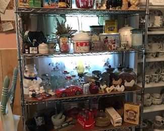 Huge collection of tins, cookie jars, mixing bowls and decorative pigs, roosters and more. 
