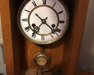 Clock face and pendulum in alternate case. With key and works. 