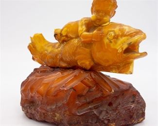 Baltic Egg Yolk Butterscotch Amber Eros on Fish Carving