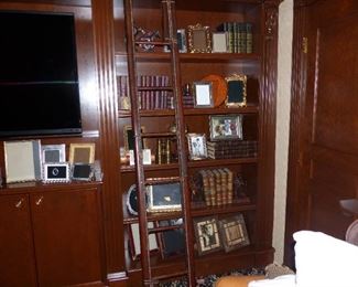 Library ladder, frames, antique books