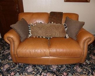 Pair of leather loveseats