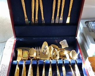 Beautiful gold flatware and case. 