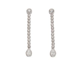 1014
A Pair Of Diamond Ear Pendants
14k white gold
Set with two pear and twenty-four full-cut round diamonds, totaling approximately 1.7cts and graded F-G color and VS-SI clarity
1.5 <br /> 1.50" L
4.5 grams
2 pieces
Estimate: $1,500 - $2,500