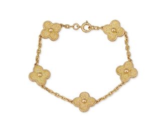 1021
A Van Cleef & Arpels "Alhambra" Bracelet
18k yellow gold, stamped: VCA / 750 / (c) / CL 3904
Designed with five textured quatrefoil links separated by a chain, with a signed wooden box
7" L x .5" W
15.4 grams
Estimate: $3,000 - $5,000