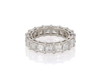 1029
A Diamond Eternity Band
Platinum
Set with seventeen square-cut diamond, totaling 5.78cts and graded F-G color and VS clarity
Ring size: 6.5
8.27 grams
Estimate: $12,000 - $18,000