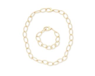 1037
A Set Of Tiffany & Co. Oval Link Jewelry
18k yellow gold, stamped: (c) T & Co. / Germany / 750
Comprising a fancy link oval necklace (18" L) and a matching bracelet (7"), may also be worn together as a longer necklace, with a signed blue suede slip case
52.2 grams gross
2 pieces
Estimate: $3,000 - $5,000