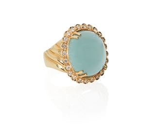 1038
A Cabochon Aquamarine And Diamond Ring
14k yellow gold
Centering a cabochon aquamarine, gauged at approximately 27cts, and surrounded by 24 full-cut round diamonds, totaling approximately 1.2cts and graded G-H color and VS clarity
Ring size: 12
30.5 grams
Estimate: $1,000 - $2,000