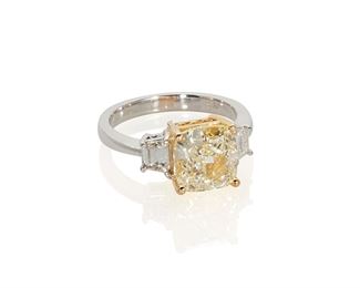 1066
A Light-Yellow Diamond Ring
18k white and yellow gold
Centering a radiant-cut diamond, weighing 4.02cts with GIA certificate dated September 01, 2020 stating W-X color and VS2 clarity, flanked by two trapezoid-cut diamonds, graded F color and VS2 clarity
Ring size: 6.75
6 grams
Estimate: $18,000 - $25,000