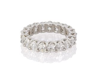 1068
A Diamond Eternity Band
Platinum
Set with nineteen oval-cut diamonds, totaling 4.53cts and graded F-G color and VS clarity
Ring size: 6.5
7.7 grams
Estimate: $5,000 - $7,000