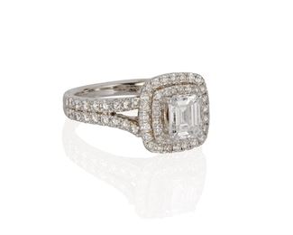 1070
A Vera Wang Diamond Ring
14k white gold
Centering an emerald-cut diamond, weighing 1.03cts with GIA report #16886183, dated March 4, 2008 stating D color and SI1 clarity, further set with ninety-six full-cut round diamonds, totaling approximately 1.25cts and graded G-H color and SI clarity
Ring size: 7
7 grams
Estimate: $5,000 - $7,000