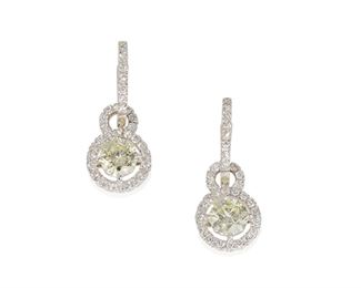 1071
A Pair Of Diamond Earrings
18k white gold, stamped: Assil / NY
Designed as hoops with detachable drops centering two fancy full-cut octagonal diamonds, totaling 2.04cts and graded light yellow color and VS clarity, further set with one hundred eighty-eight round diamonds, totaling 1.41cts and graded
.9" L
4.9 grams
4 pieces
Estimate: $6,000 - $8,000