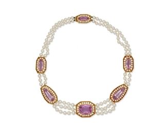 1072
A Caramati Topaz, Diamond, And Cultured Pearl Necklace
18k yellow gold, stamped: Caramati / 18k
Set with six purplish-pink topaz, comprising one cushion-cut gauged at 23cts, two pear-shaped totaling 21.1cts, and three marquise-cut totaling approximately 12.5cts, further set with one hundred sixteen full-cut round diamonds totaling approximately 10cts and graded F-G color and VS clarity, interspersed with a double strand of cultured pearls measuring 5.5-6 mm
18" L x 1" H
101 grams
Estimate: $7,000 - $9,000