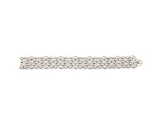1073
A Diamond Bracelet
18k white gold
Set with eight hundred full-cut round diamonds, totaling approximately 8cts and graded G-H color and VS clarity
7" L x .75" W
59.2 grams
Estimate: $6,000 - $8,000