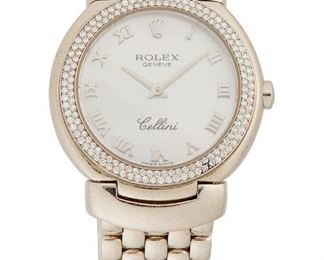 1076
A Rolex Diamond And Mother-Of-Pearl Wristwatch, Cellini
18k white gold
Ref: 66711999RB2119
Dial: circular mother-of-pearl dial, applied polished Arabic hour markers, signed: Rolex / Geneve / Cellini
Movement: 8 jewel quartz stem set movement, Cal: 6620, signed: Montres / Rolex S.A. / Geneva / Swiss
Case/bracelet: 18k white gold case with micro-pave diamond set bezel, Ref: 6671, Serial K660151, hallmarked, 18k white gold link bracelet, hallmarked, signed: Rolex / Geneve, with stock box and papers
33 mm x 21 mm, 6.75" Dia.
72 grams gross
Estimate: $5,000 - $7,000