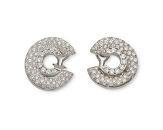 1089
A Pair Of Diamond Swirl Ear Clips
14k white gold
Designed as fanned hoops set with one hundred thirty-six full-cut round diamonds, totaling approximately 5cts and graded G-H color and VS-SI clarity
1" W
16.8 grams
2 pieces
Estimate: $3,000 - $5,000