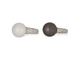 1090
A Pair Of Mikimoto "Milano" Cultured Pearl And Diamond Rings
18k white gold, stamped: M [within shield for Mikimoto] / 750 / Made in Italy
Comprising two rings designed with pave diamonds, totaling approximately 2.4cts and graded F-G color and VS clarity, one ring with a grey Tahitian cultured pearl measuring 12.8 mm, the other with a white cultured pearl measuring 11.5 mm, one with signed blue suede ring box
Ring size each: 5.5
17 grams gross
2 pieces
Estimate: $2,500 - $3,500