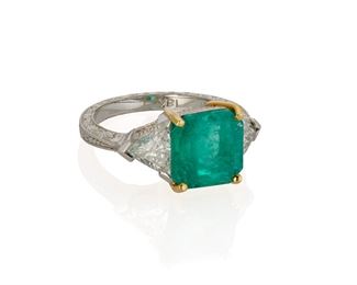 1098
An Emerald And Diamond Ring
Platinum and 18k yellow gold
Centering a rectangular-cut emerald, weighing 3.95cts, flanked by two triangular-cut diamonds, totaling approximately 1.1ct and graded H-I color and VS-SI clarity
Ring size: 6.75
9 grams
Estimate: $5,000 - $7,000