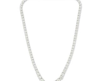 1100
A Graduated Diamond Line Necklace
18k white gold
Centering a full-cut round diamond, weighing 2cts, and flanked by two round diamonds, weighing 1.51cts and 1.54 cts and graded J-K color and VS2 clarity, further set with eighty-six full-cut diamonds, totaling 24.5cts and graded H-K color and VS2-I1 clarity
16.5" L
38.05 grams
Estimate: $30,000 - $40,000