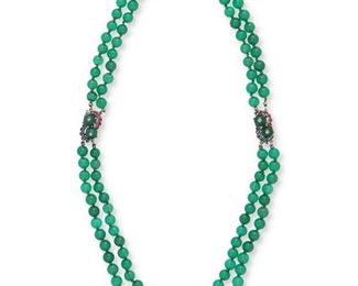 1105
A Chrysoprase And Gem-Set Necklace
Circa 1950, 14k white gold
Designed as a long double strand necklace of chrysoprase beads that may be converted into a single choker necklace, the two clasp terminals are set with ten round rubies, ten round sapphires two chrysoprase beads topped with a single round diamond
20" L or 11" L, dimensions vary
77 grams
2 pieces
Estimate: $2,500 - $3,500